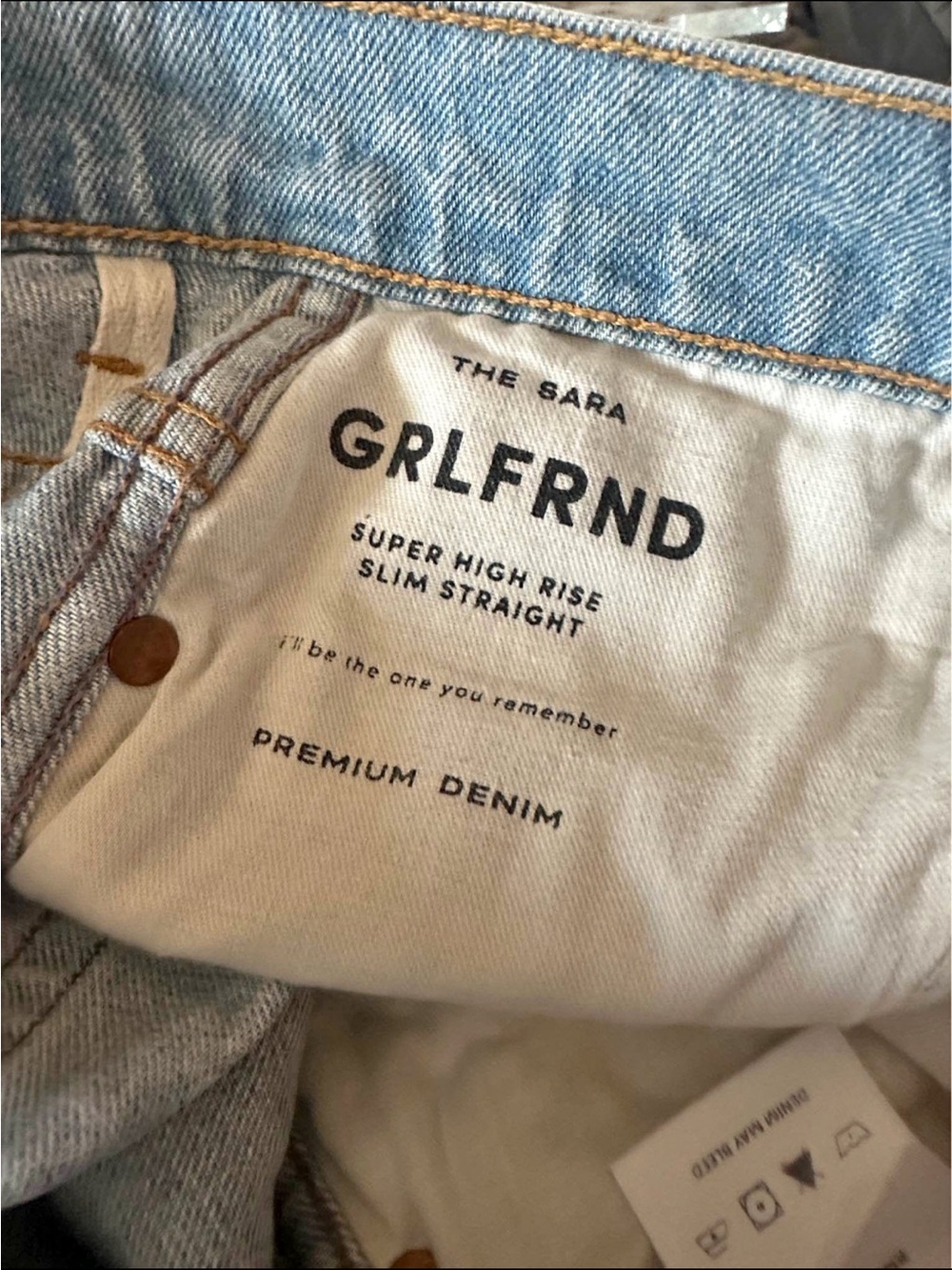 GRLFRND Slim Straight Jeans in Light Blue Denim. 100% cotton.